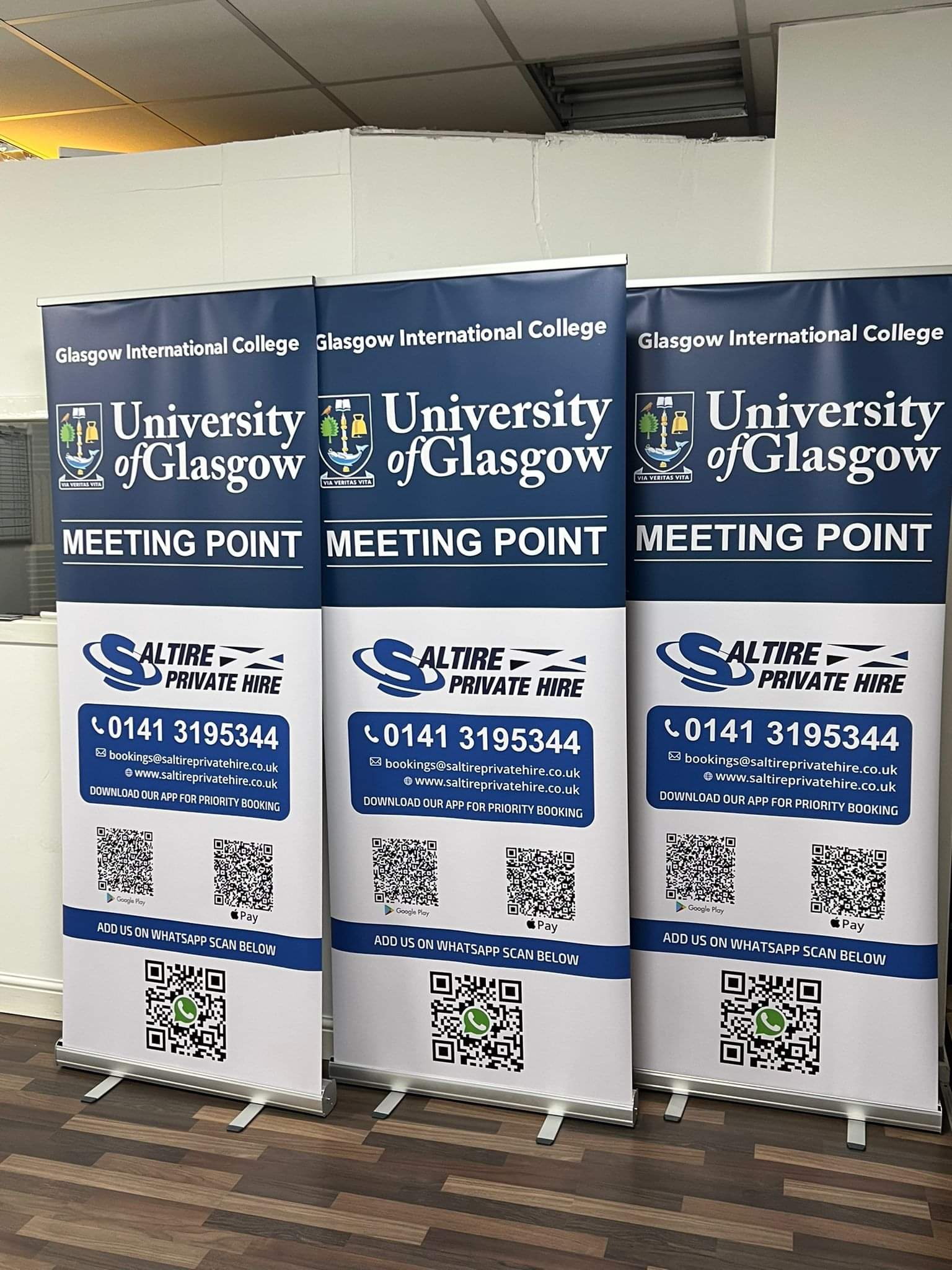 Three printed University of Glasgow meeting point roller banners